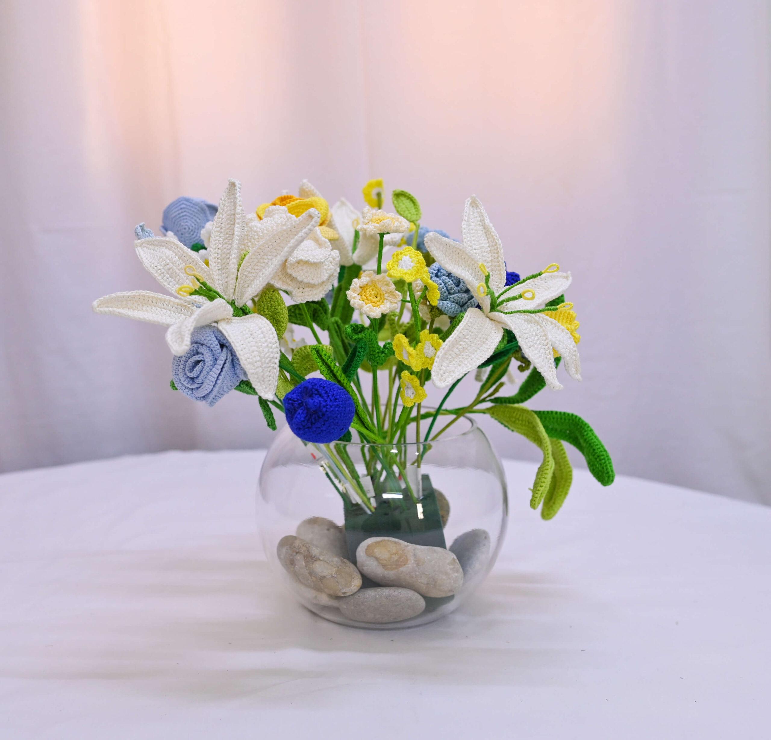 A vase of Happy Threads crochet blooms